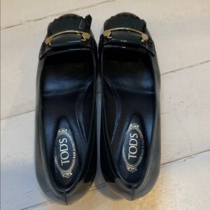 Tod's Black Patent Leather Kiltie Loafers with Gold Trim